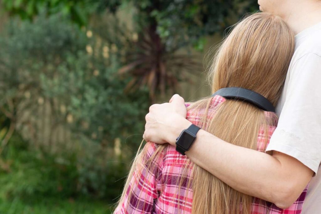 father hugs teenage daughter parents and teens re 2022 11 15 14 04 13 utc