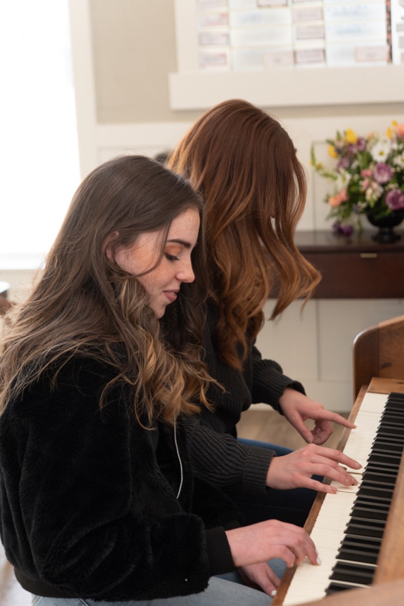 Girls playing piano, North campus, New Haven Residential Treatment Center