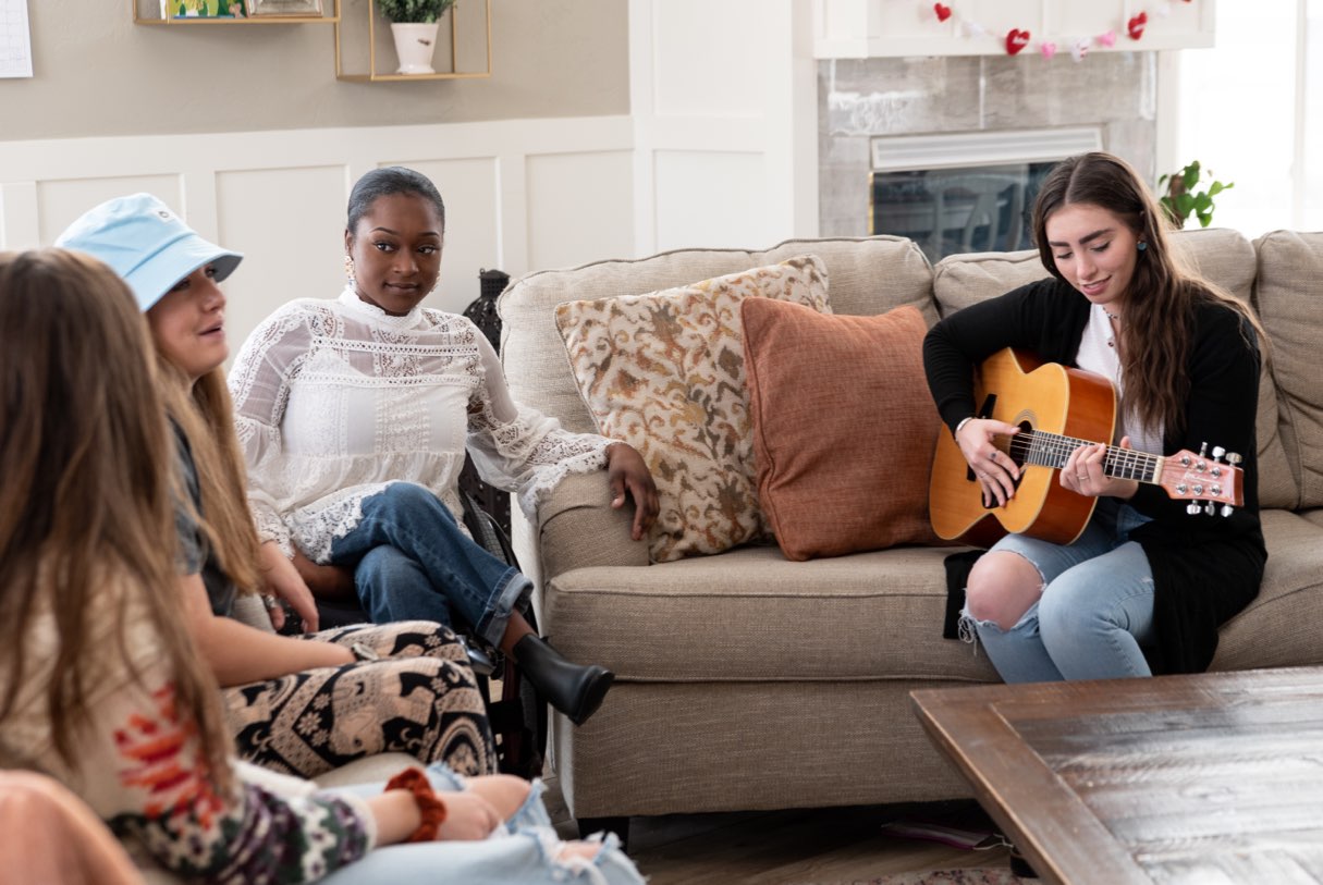 Playing the guitar at Saratoga Springs house, New Haven Residential Treatment Center