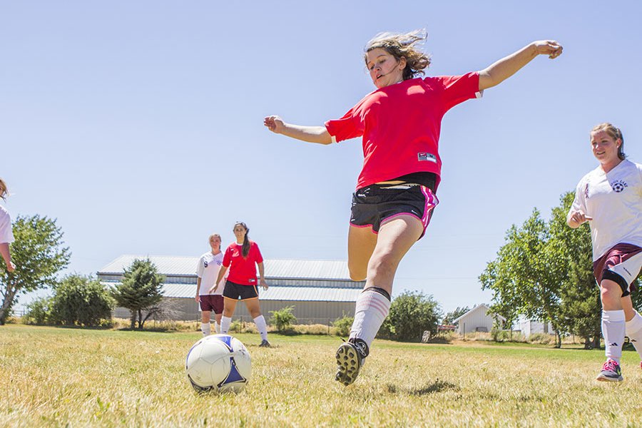 Girl playing soccer at New Haven Residential Treatment Center